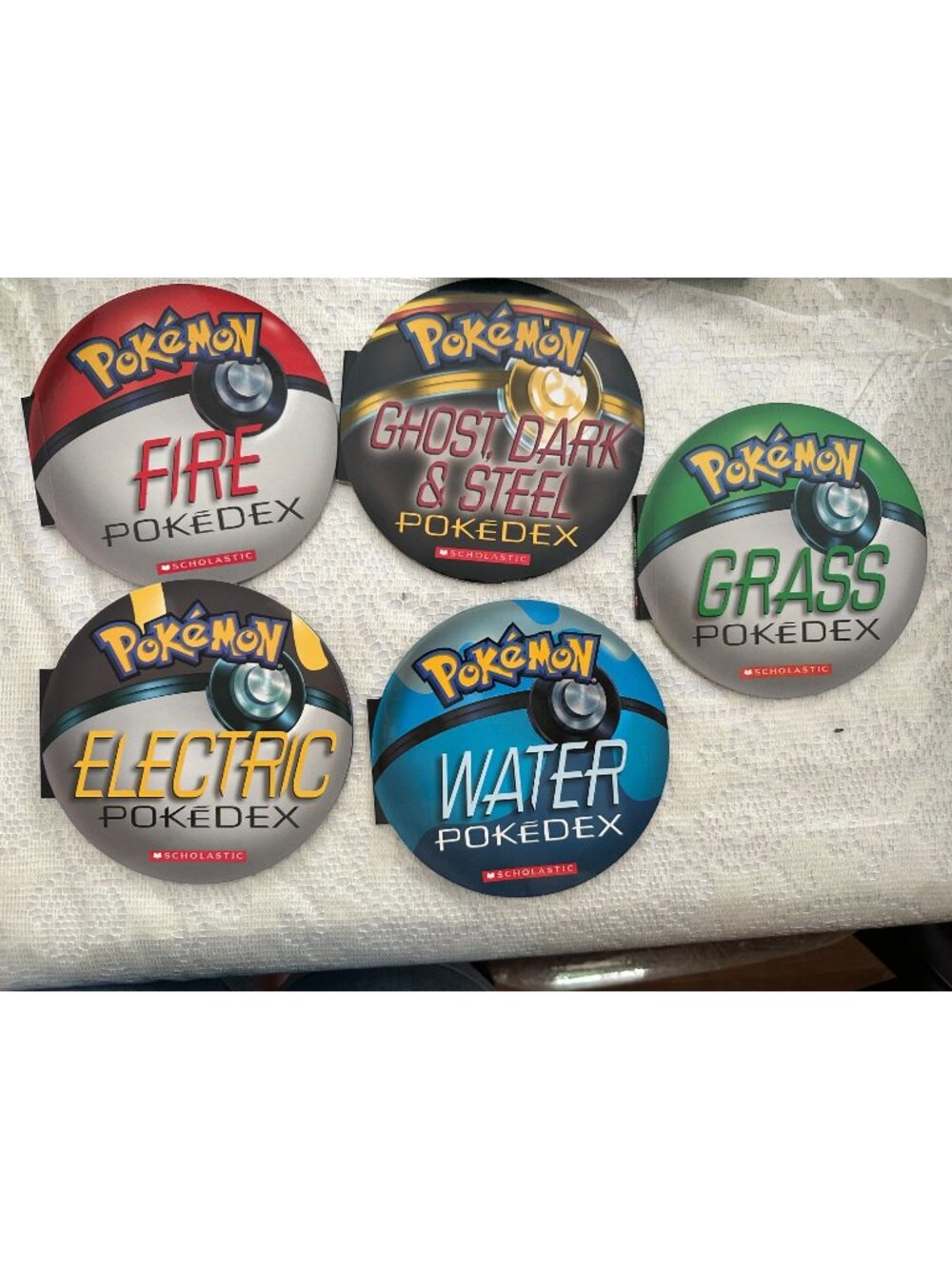 5 Scholastic Pokémon Pokédex booklets shaped like Pokéballs